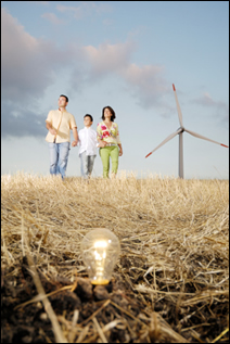 Family walking by wind turbine